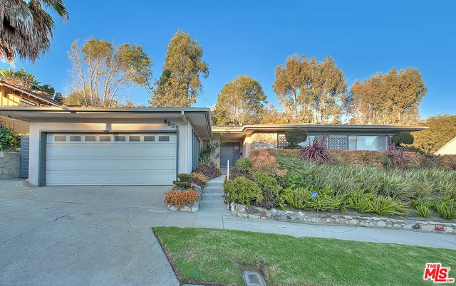front view of a house with a big yard