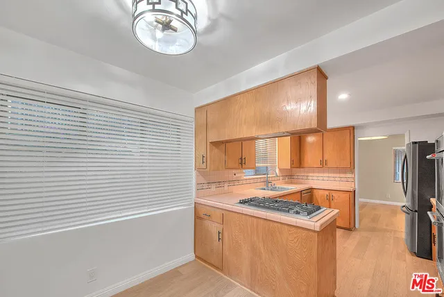 a view of an empty room with a painting