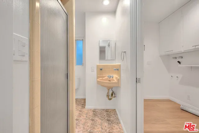 a kitchen with stainless steel appliances granite countertop a sink and wooden cabinets