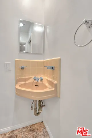 a kitchen with stainless steel appliances granite countertop a sink and dishwasher a stove with wooden floor