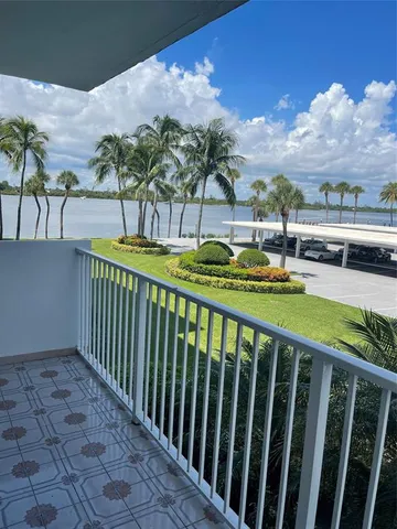 a view of a swimming pool with a lounge chairs
