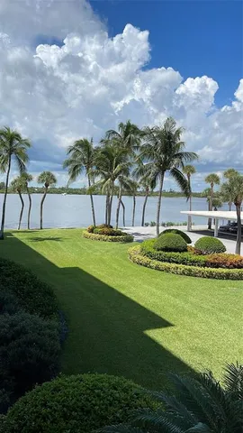 a view of a swimming pool with a yard