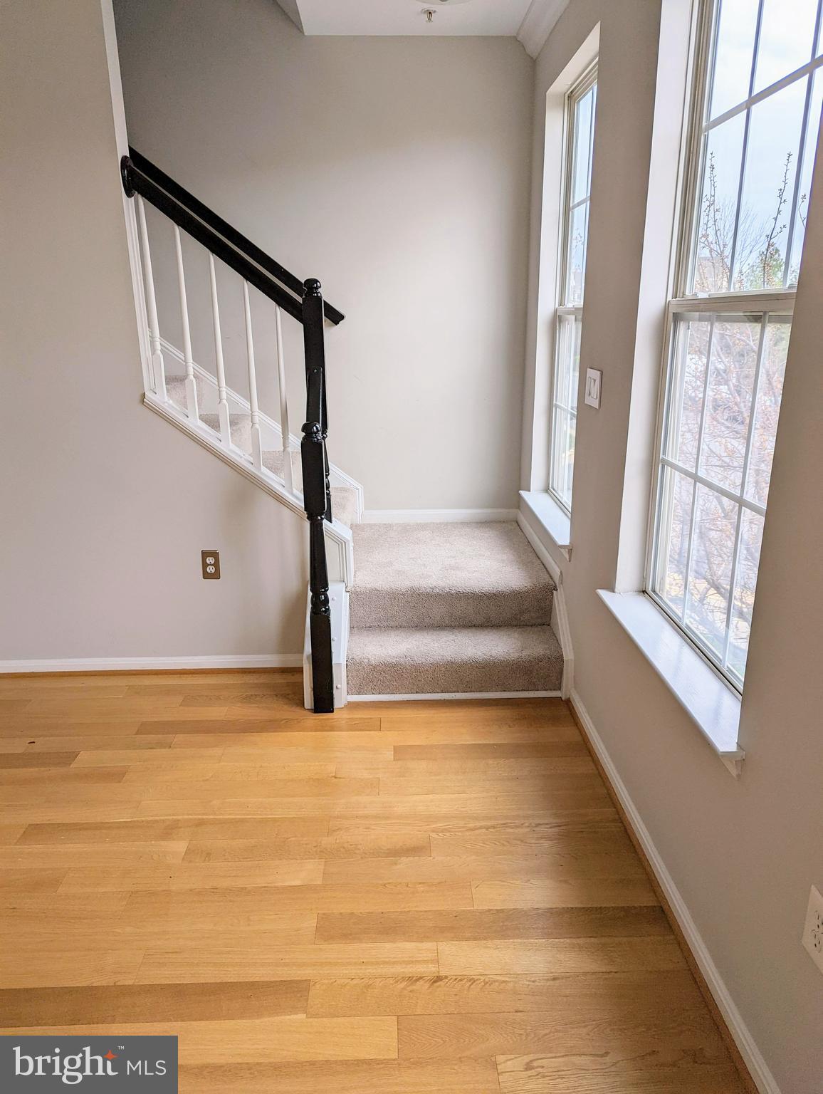 21765 Ascot Court Ashburn, VA 20147 - Photo 15 of 32 a view of staircase with white walls and a window