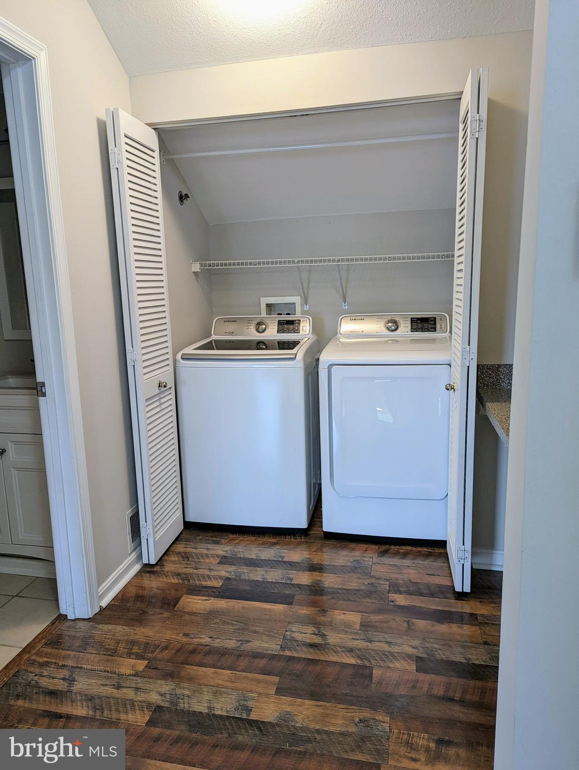 21765 Ascot Court Ashburn, VA 20147 - Photo 17 of 32 a utility room with wooden floor washer and dryer