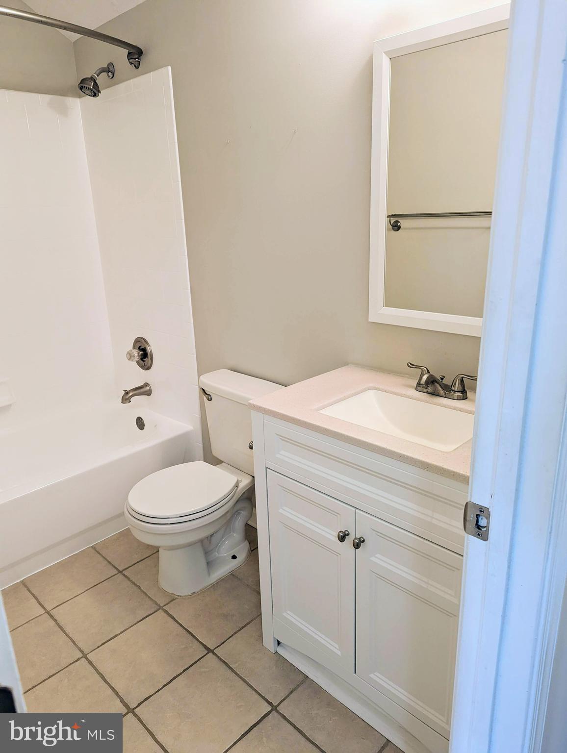 21765 Ascot Court Ashburn, VA 20147 - Photo 18 of 32 a bathroom with a sink a toilet and shower