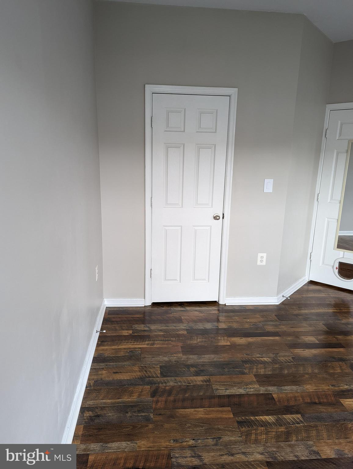 21765 Ascot Court Ashburn, VA 20147 - Photo 26 of 32 a view of an empty room and wooden floor