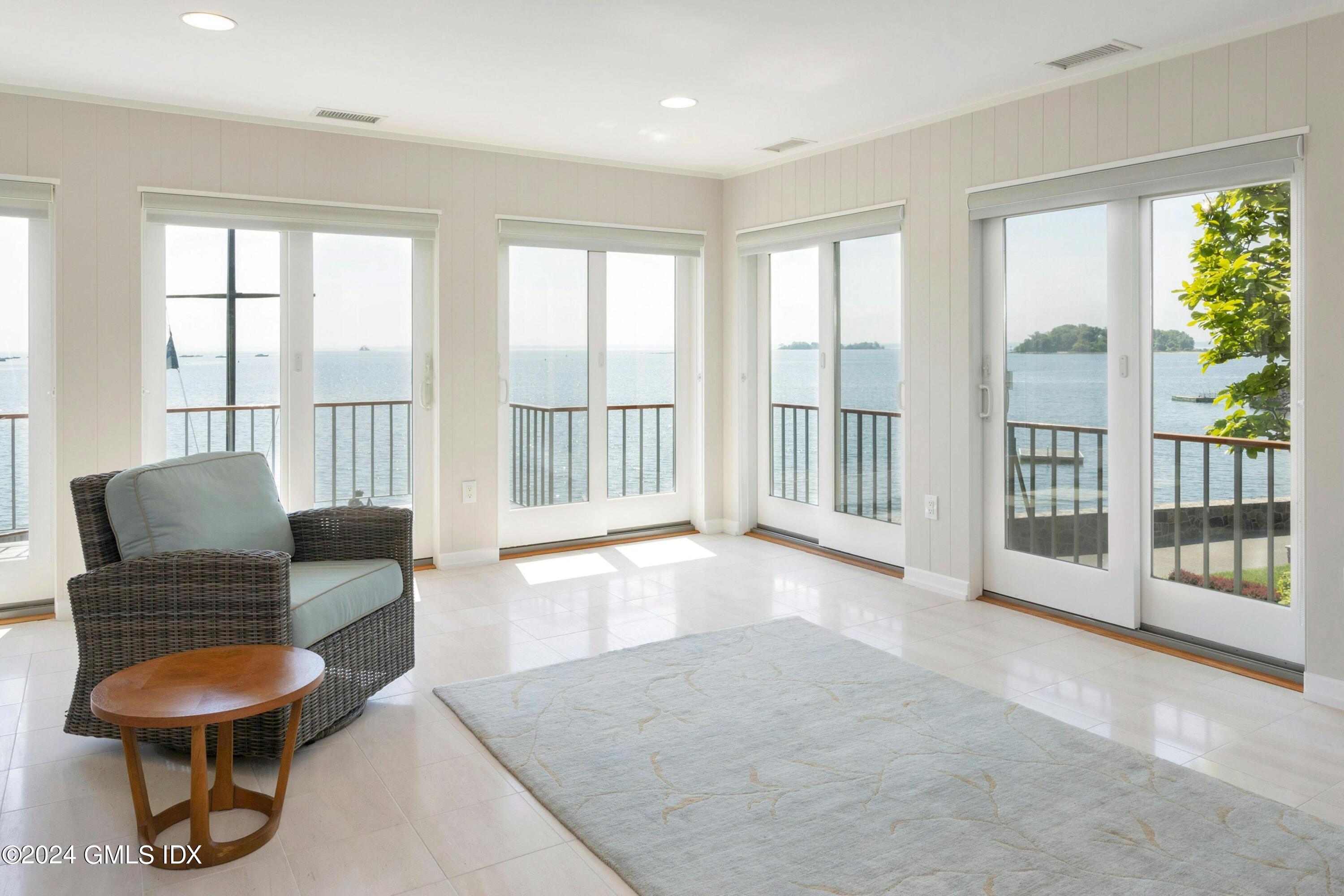 36-38 Game Cock Road Greenwich, CT 06830 - Photo 11 of 34 a living room with furniture and a large window