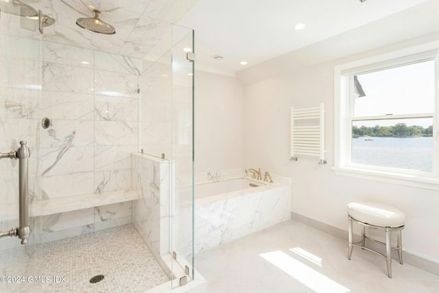 a bathroom with a bathtub and a toilet