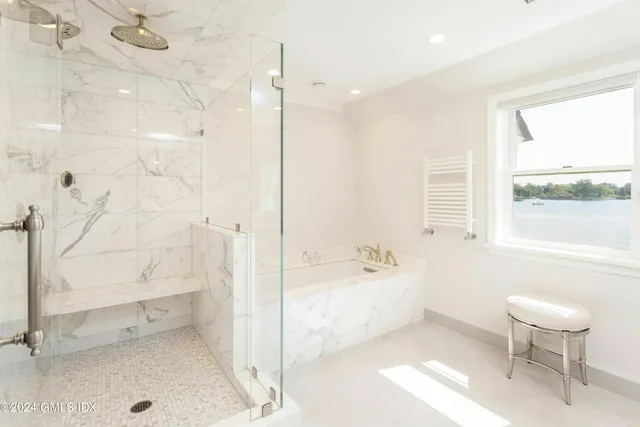 a bathroom with a bathtub and a toilet