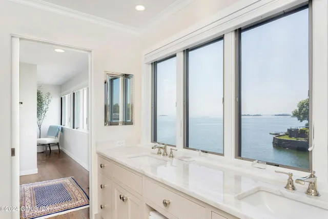 a bathroom with a double vanity sink and a mirror