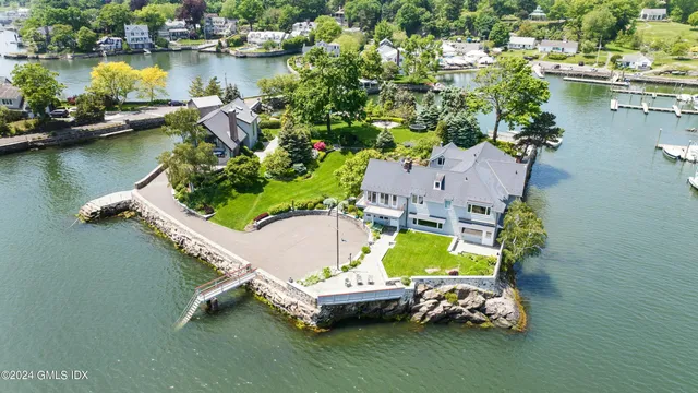 an aerial view of a house with a lake view