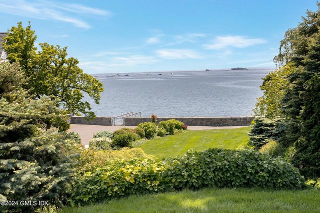 a view of a lake with a yard