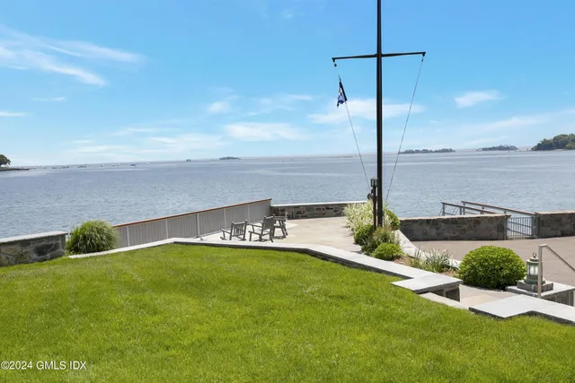 a view of a garden with lawn chairs