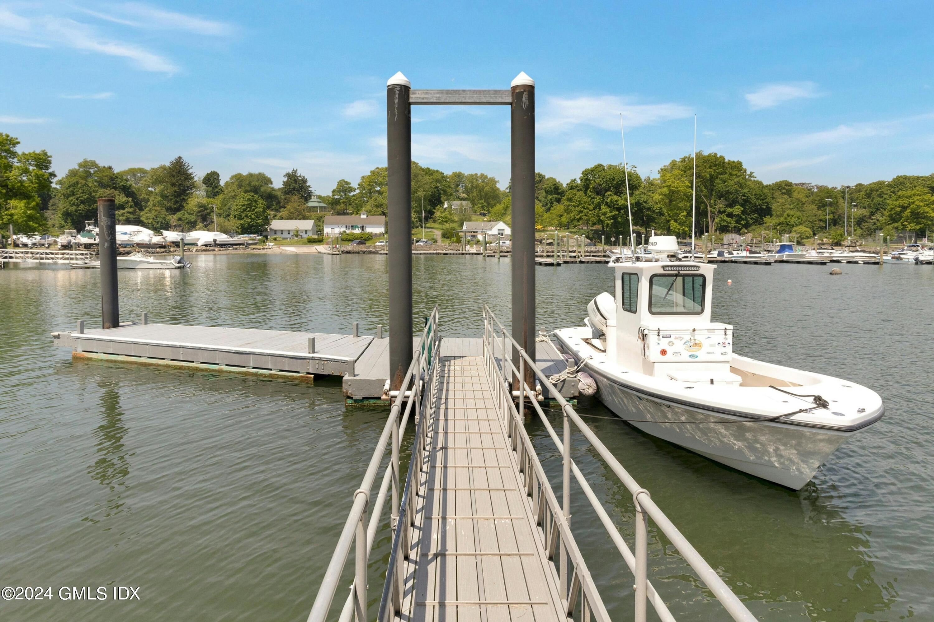 36-38 Game Cock Road Greenwich, CT 06830 - Photo 30 of 34 a view of a lake with boats and palm trees