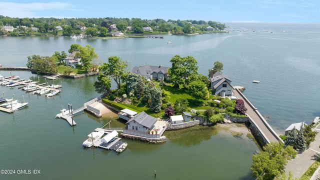 an aerial view of a house with a lake view