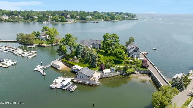 an aerial view of a house with a lake view