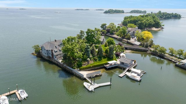 an aerial view of a house with a lake view