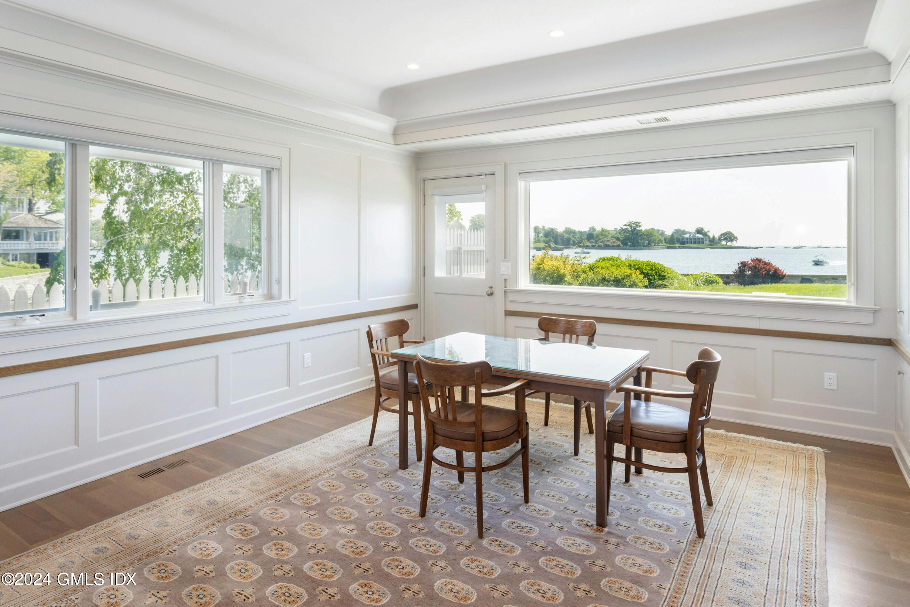36-38 Game Cock Road Greenwich, CT 06830 - Photo 10 of 34 a view of a dining room with furniture window and outside view