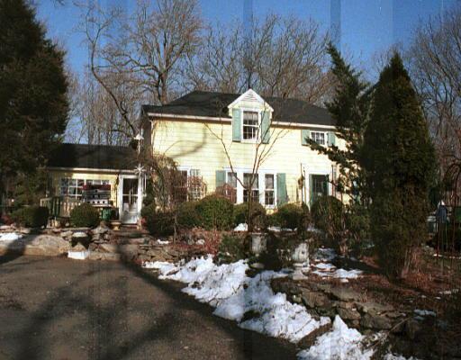 372 Georgetown Road Weston, CT 06883 - Photo 1 of 1 a front view of a house with a yard