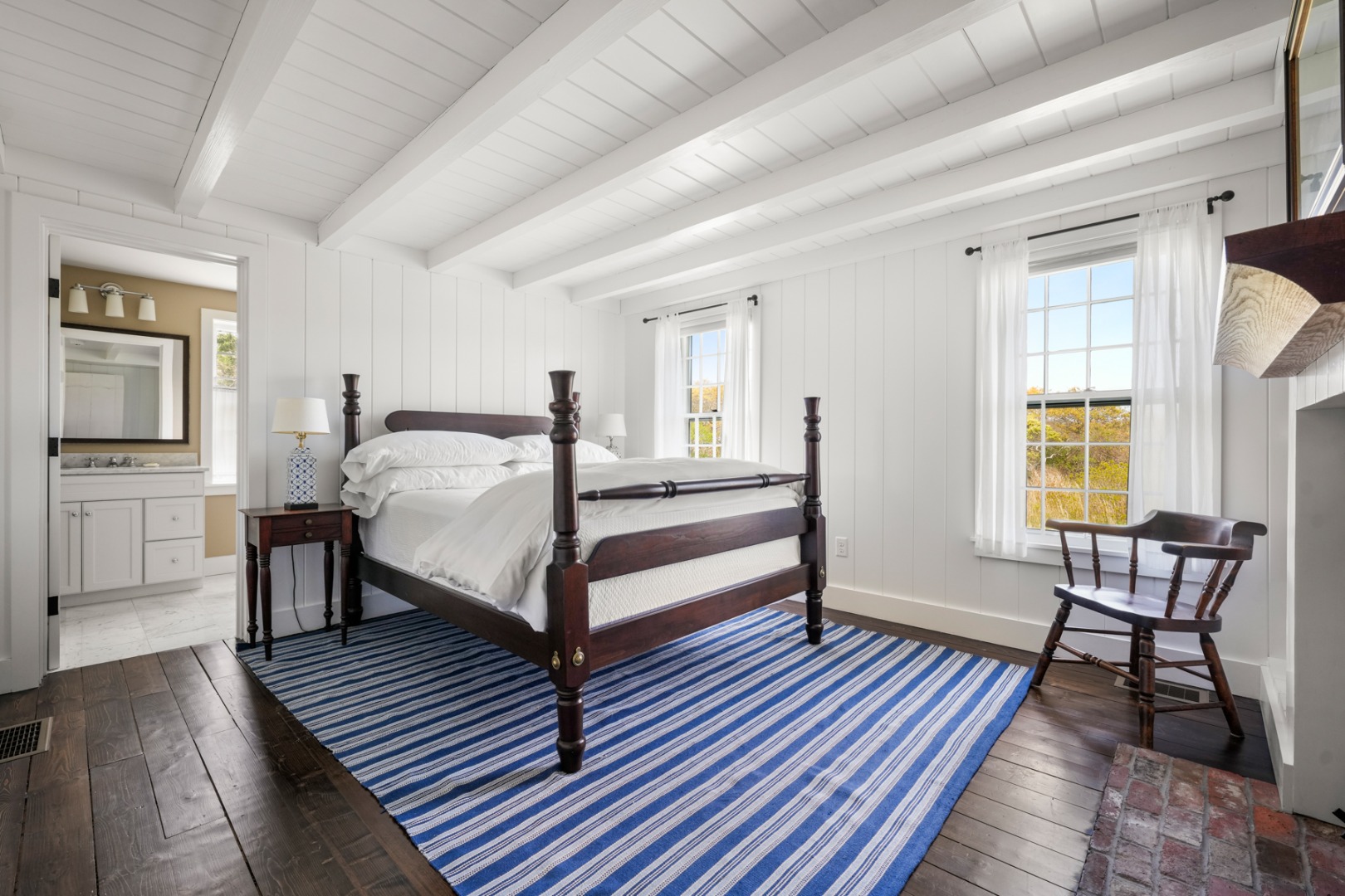 21 Quidnet Road Nantucket, MA 02554 - Photo 15 of 62 a bedroom with a bed and a table