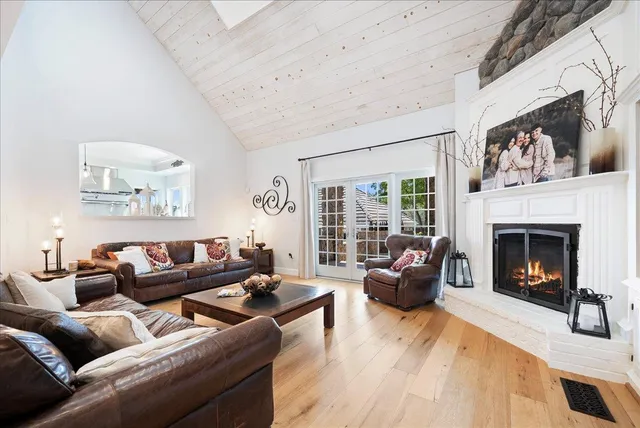 a bedroom with furniture and a wooden floor