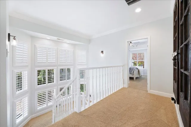 a spacious bedroom with a bed and a window