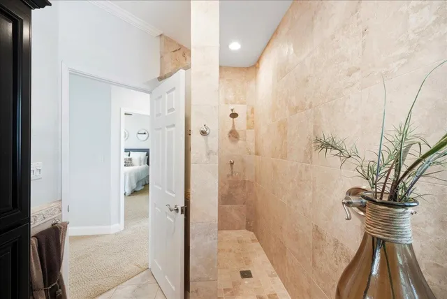 a view of a kitchen with a sink and dishwasher a stove top oven with wooden floor