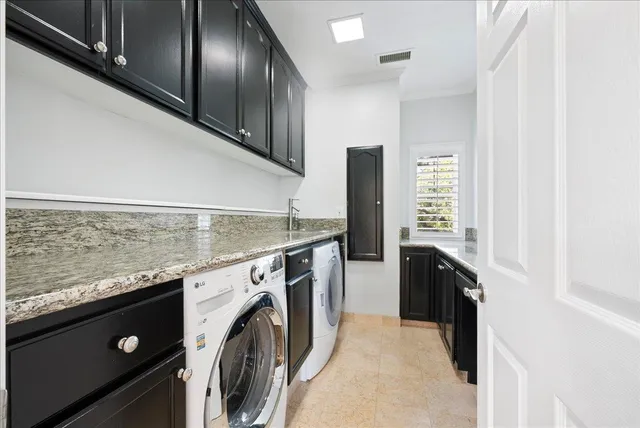 a bed room with a bed and a chair