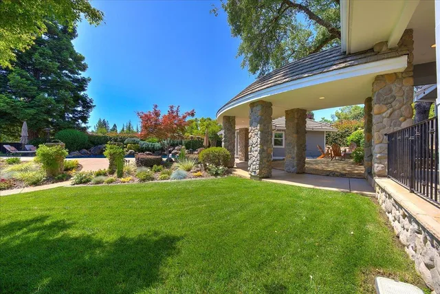 a front view of house and yard with green space