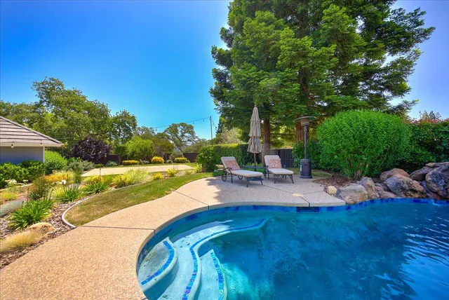 a view of a house with a yard porch and sitting area