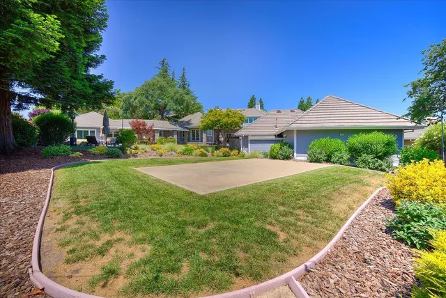 a front view of a house with a garden and porch