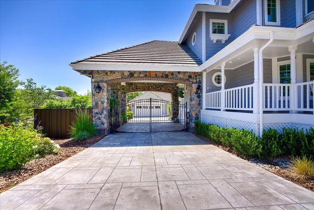 a view of a two chairs in the balcony