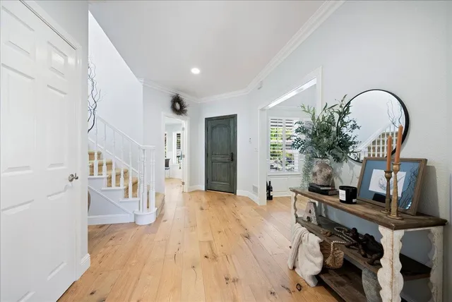 a dining room with furniture and wooden floor