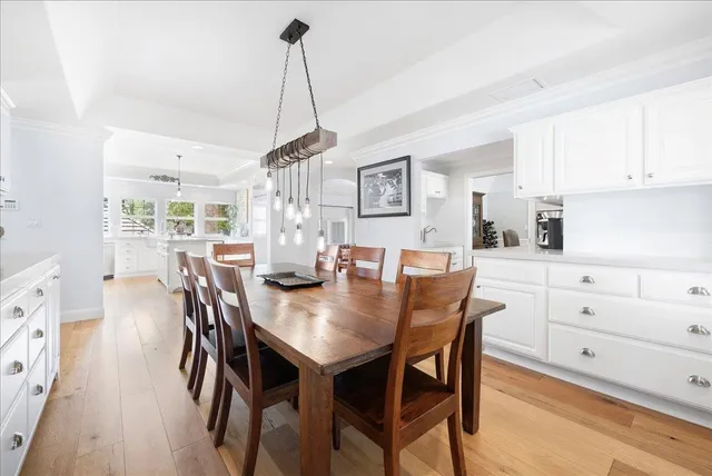 a kitchen with stainless steel appliances a stove a sink and a window