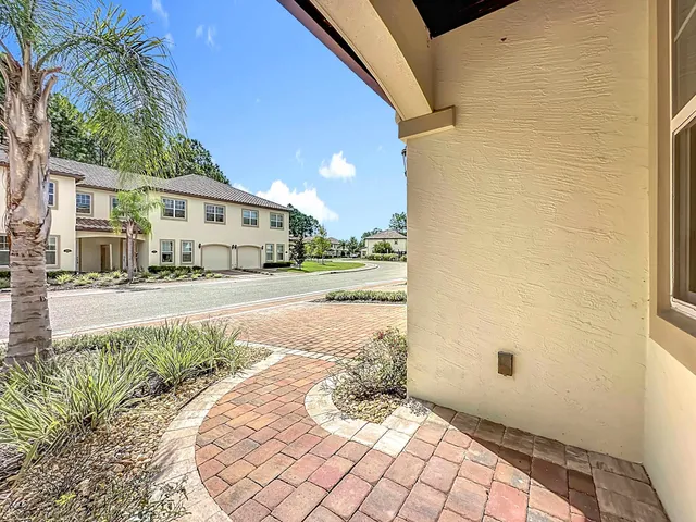 a view of a street with a building in the background