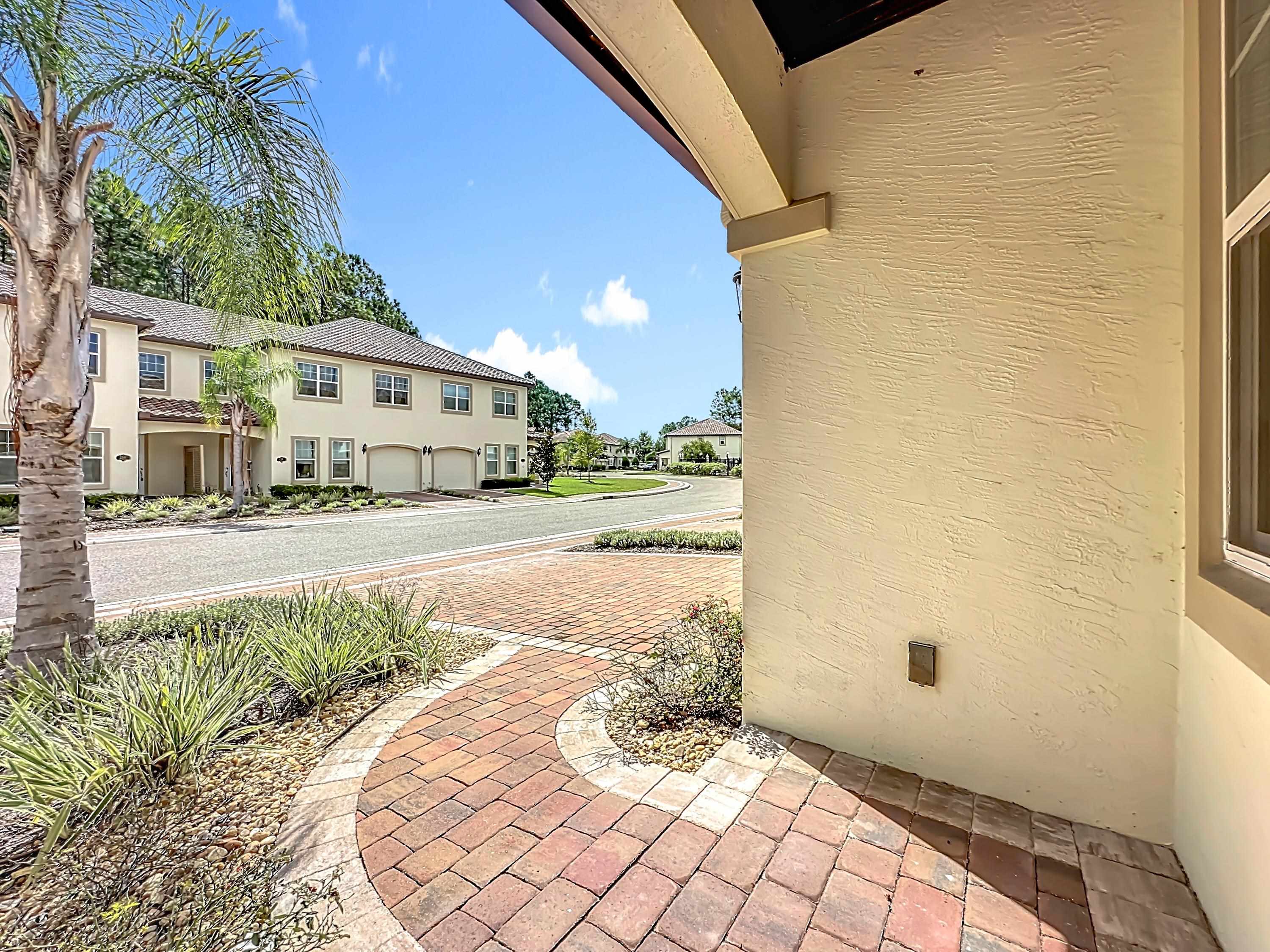 251 Grand Ravine Drive St. Augustine, FL 32086 - Photo 2 of 37 a view of a street with a building in the background
