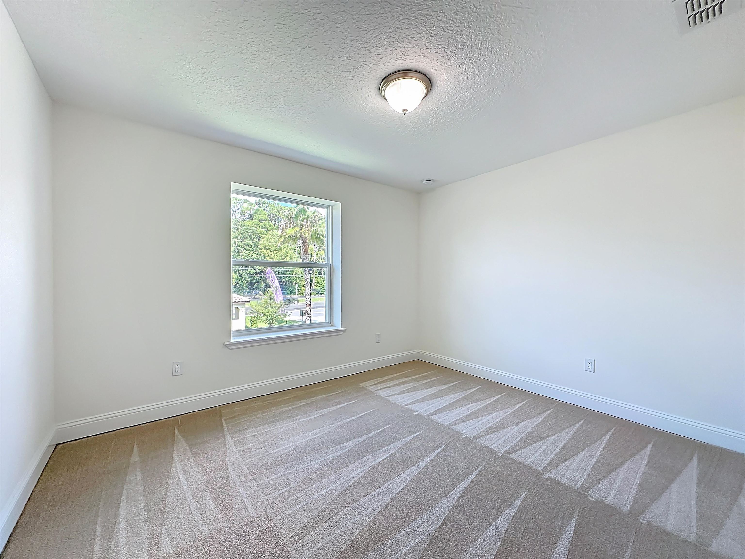 251 Grand Ravine Drive St. Augustine, FL 32086 - Photo 22 of 37 an empty room with a window