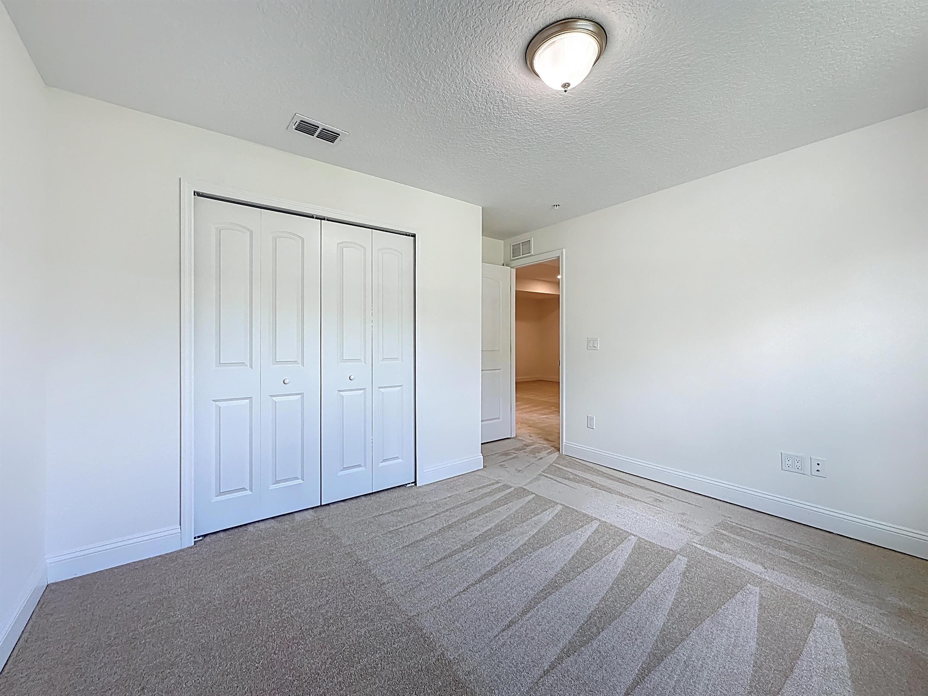 251 Grand Ravine Drive St. Augustine, FL 32086 - Photo 26 of 37 an empty room with closet area