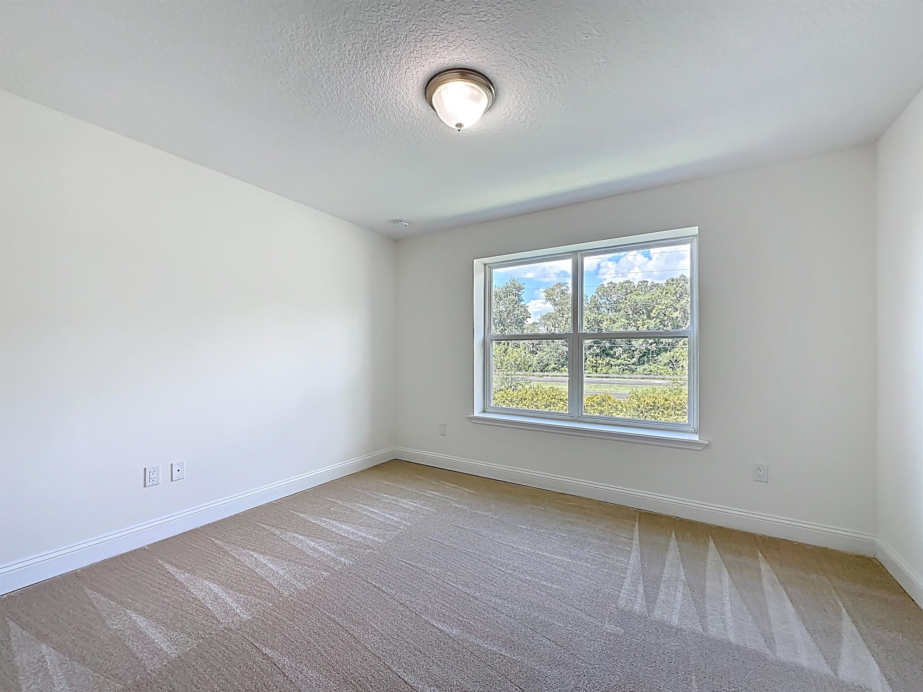 251 Grand Ravine Drive St. Augustine, FL 32086 - Photo 27 of 37 an empty room with a window