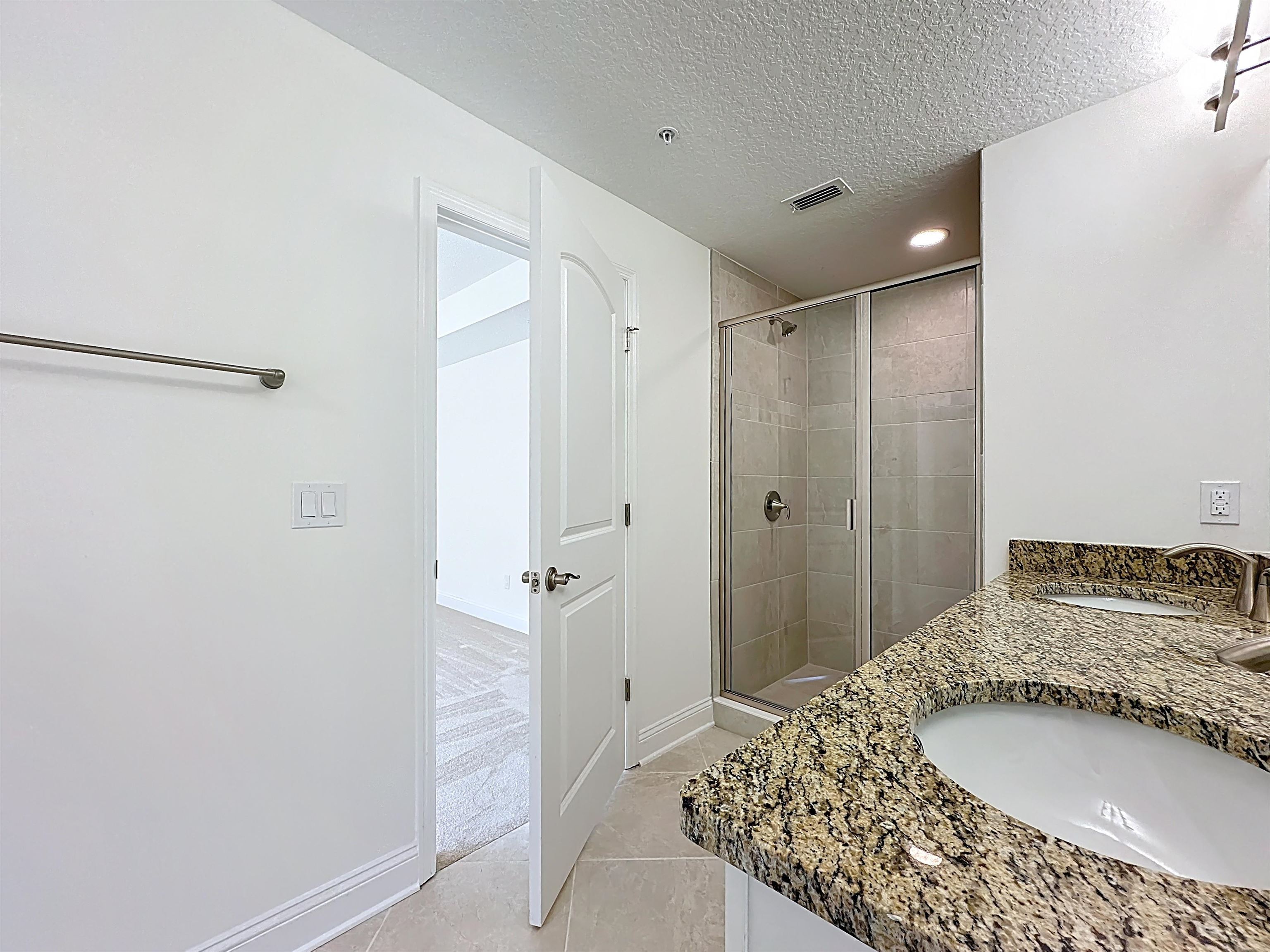 251 Grand Ravine Drive St. Augustine, FL 32086 - Photo 31 of 37 a bathroom with a granite countertop sink and a mirror