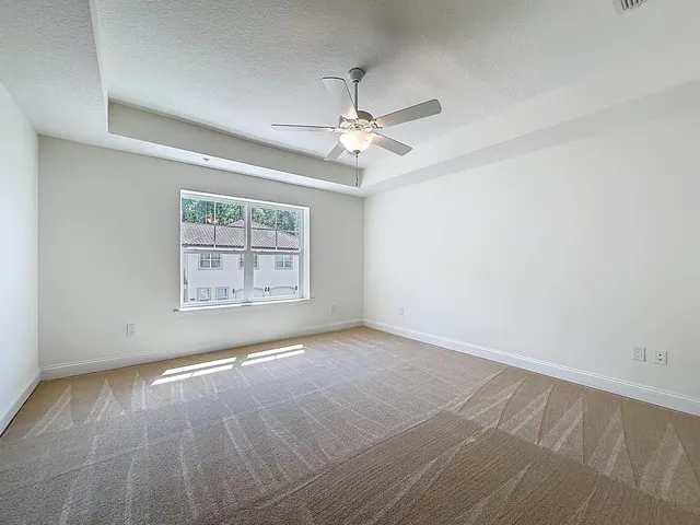 a bathroom with a granite countertop sink shower and a mirror
