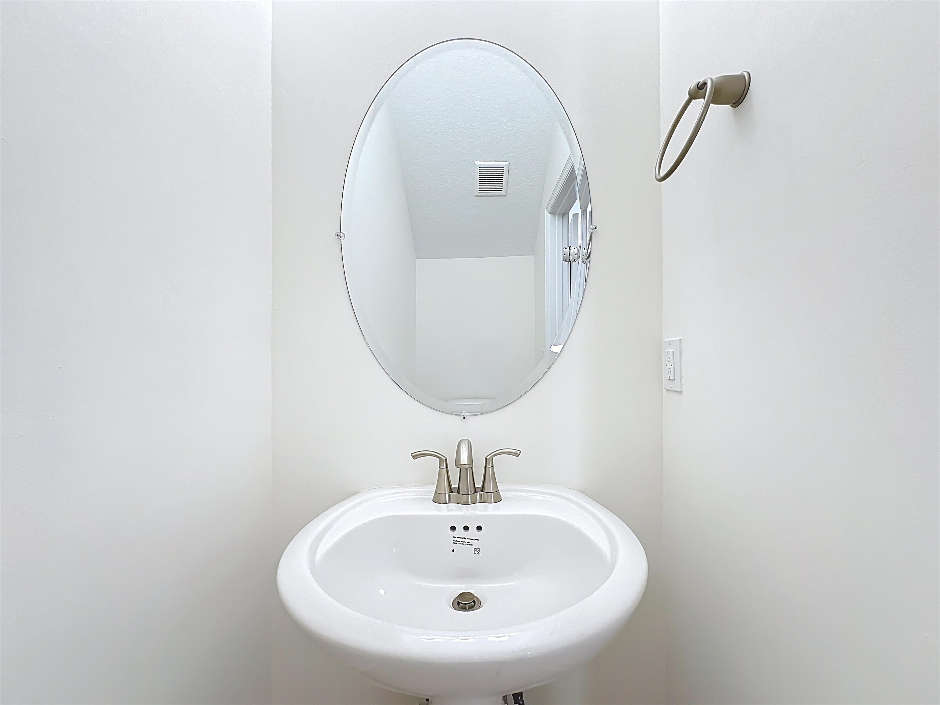 251 Grand Ravine Drive St. Augustine, FL 32086 - Photo 5 of 37 a bathroom with a sink and a mirror