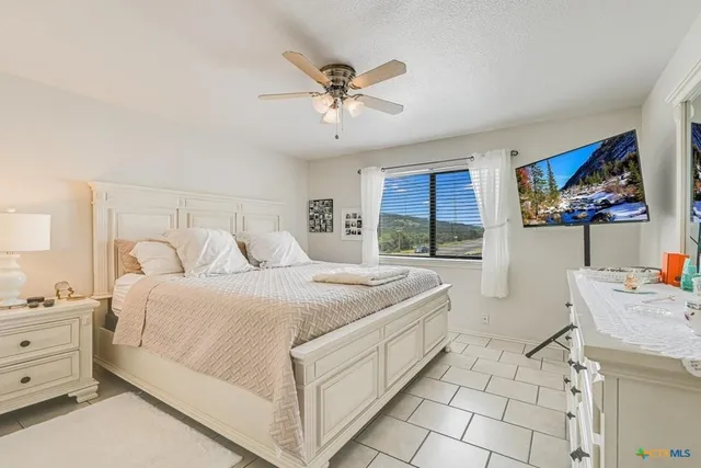 a bed room with a bed and a window