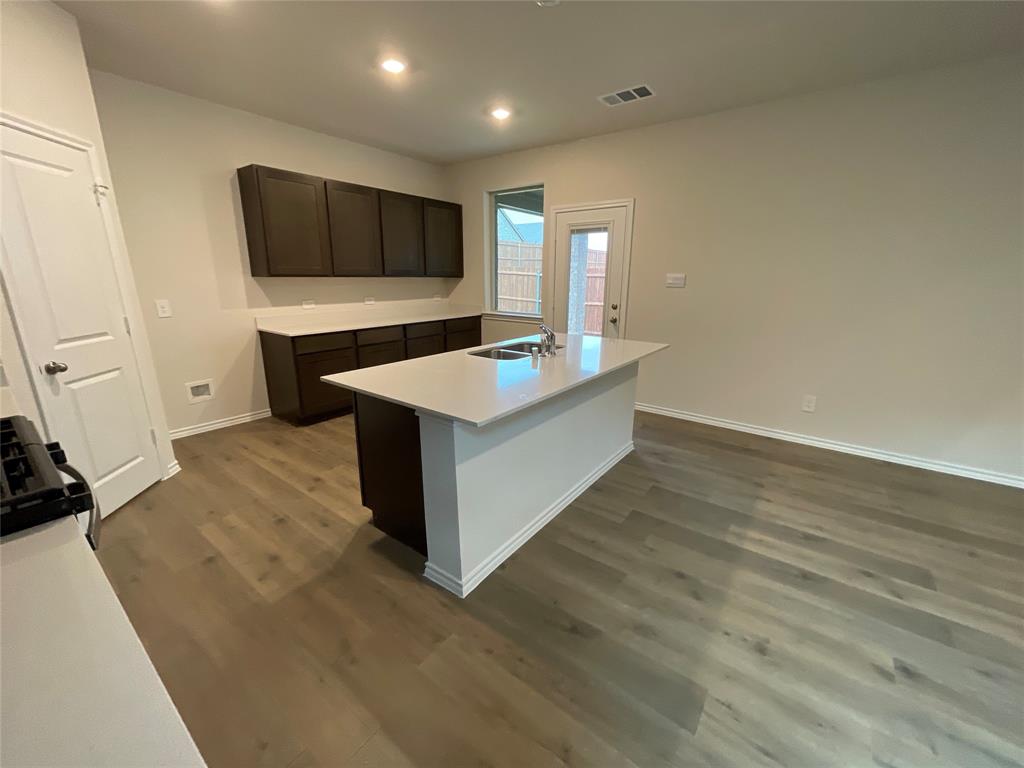 657 Chipper Trail Lavon, TX 75166 - Photo 11 of 24 a view of kitchen with microwave oven and cabinets