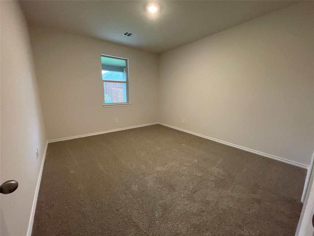 657 Chipper Trail Lavon, TX 75166 - Photo 14 of 24 an empty room with windows