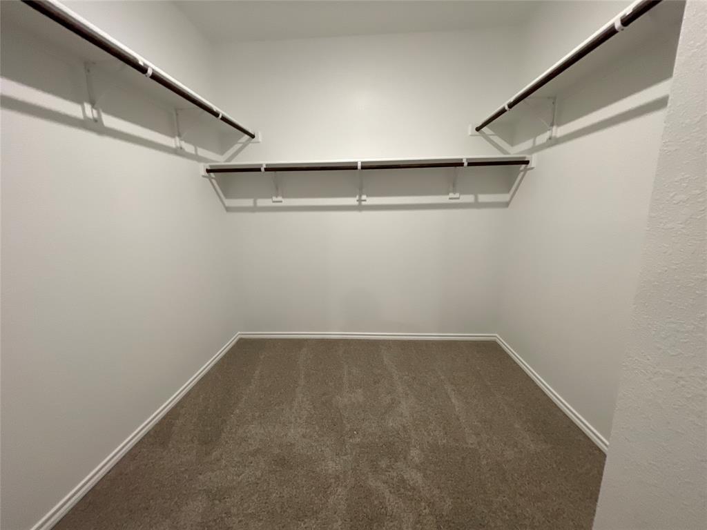 657 Chipper Trail Lavon, TX 75166 - Photo 17 of 24 a view of a room with racks on the wall