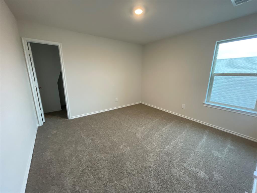 657 Chipper Trail Lavon, TX 75166 - Photo 18 of 24 an empty room with a window