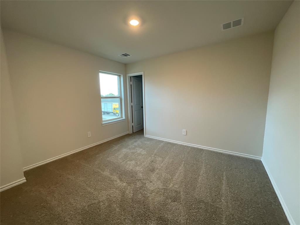 657 Chipper Trail Lavon, TX 75166 - Photo 20 of 24 an empty room with windows and closet