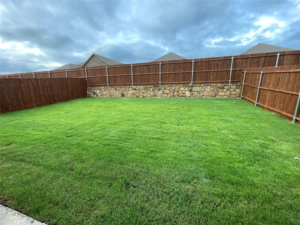 657 Chipper Trail Lavon, TX 75166 - Photo 23 of 24 a view of a field with wooden fence