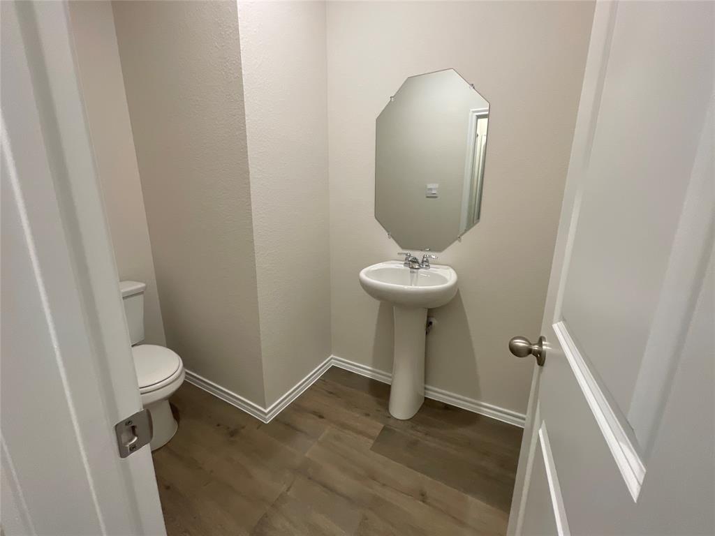 657 Chipper Trail Lavon, TX 75166 - Photo 6 of 24 a view of bathroom with a toilet